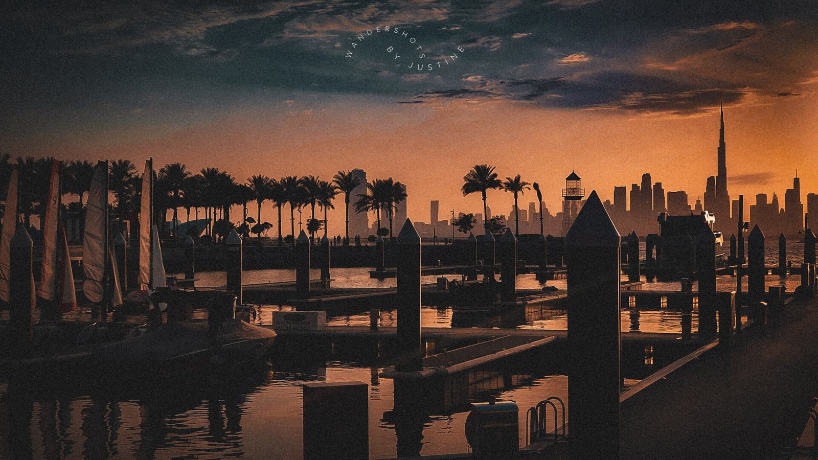 Marina pier silhouettes at sunset